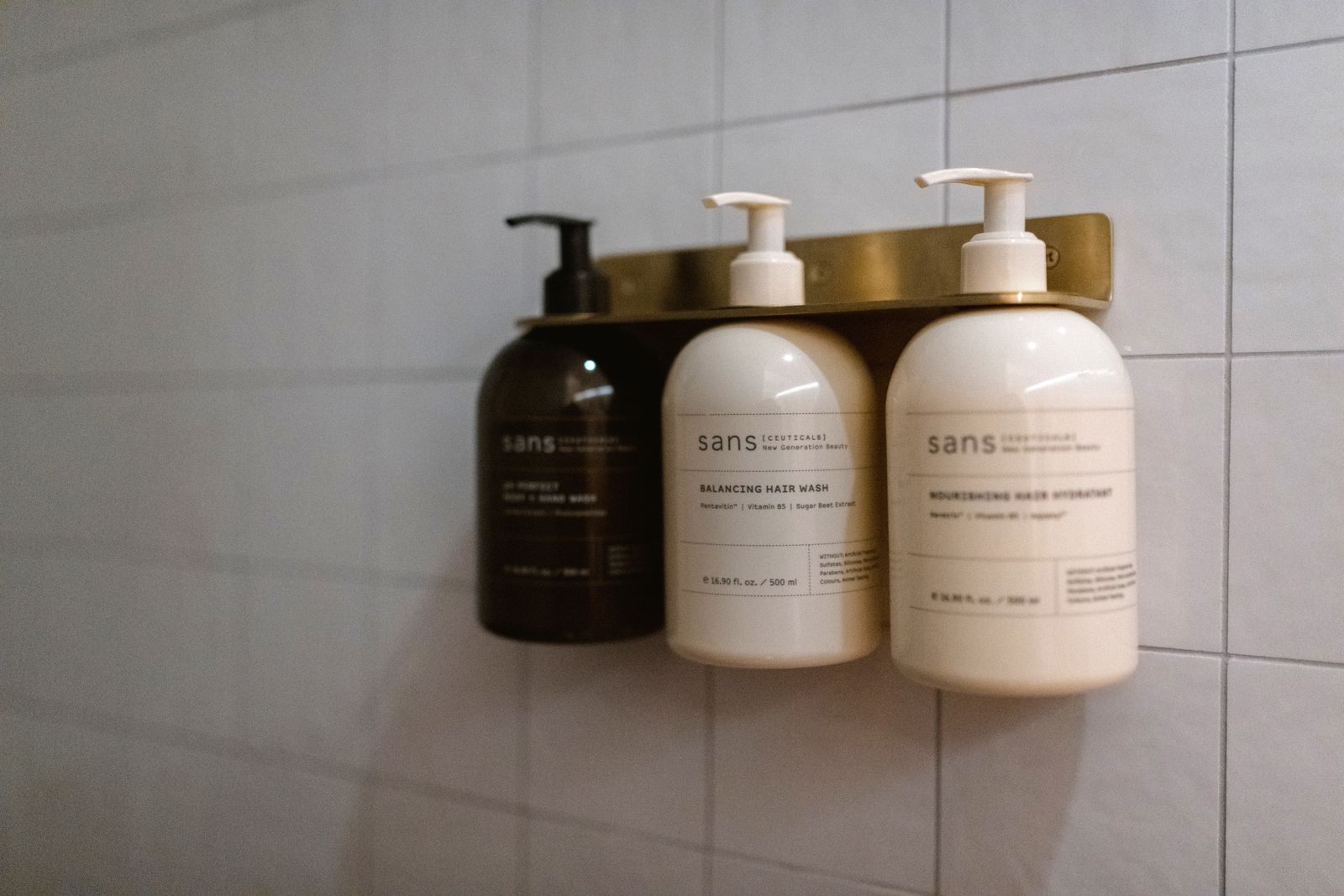 Body care essentials in the shower at Boon Wellness